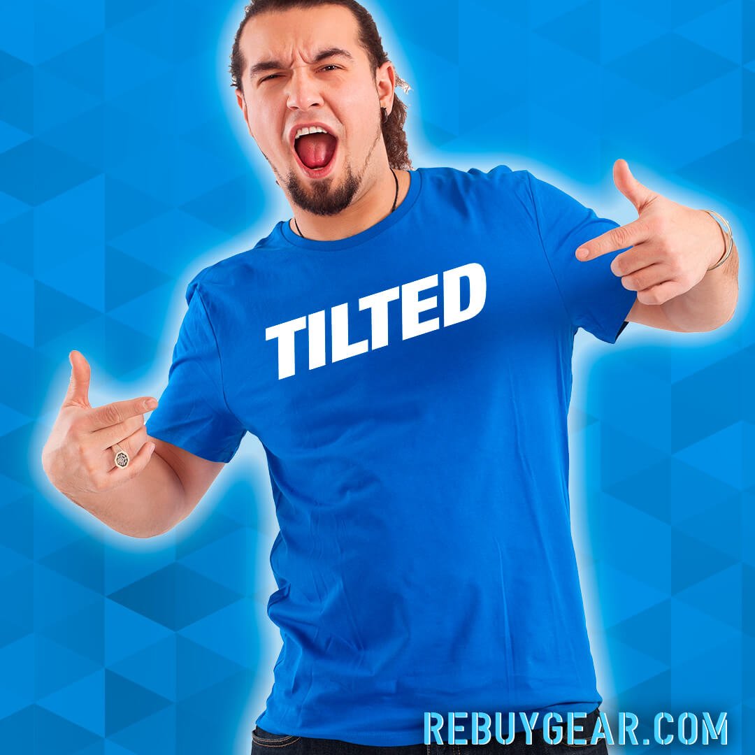 Man with a blue shirt with the word TILTED on it.